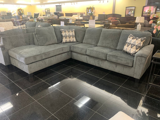 Raina sectional a traditional style with classic wood feet and 2 overstuffed back cushions for added comfort.