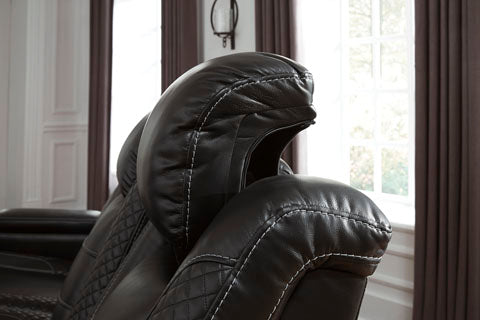 The Ultra features a black faux leather upholstery with cross-hatched stitching detail, as well as reclining and manual reclining functions - Lifestyle Furniture