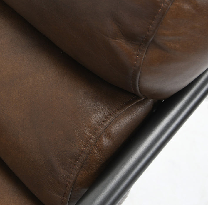 Made with a tube iron base and upholstered with top grain leather, this brown accent chair features plush cushions for maximum comfort - Lifestyle Furniture