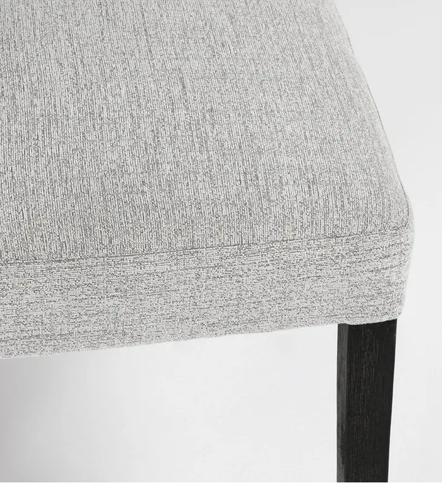 The linen blend upholstery allows for easy cleaning, and combines with the curvy back and legs to give the dining chair a modern look - Lifestyle Furniture