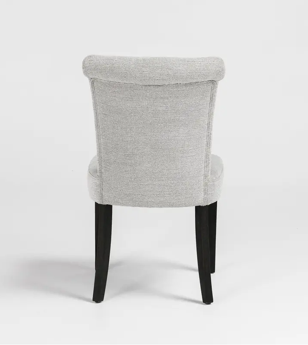 The modern silhouette and curvy back design of these chairs create a welcoming look for any occasion - Lifestyle Furniture