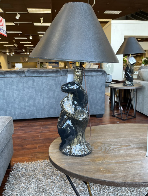 A sleek design is combined with a warm yellow glow in the Black Panther table lamp - Lifestyle Furniture