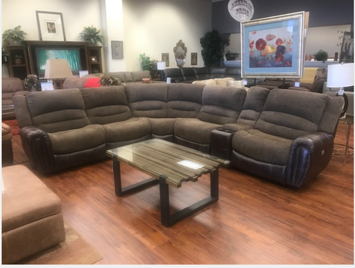 This sectional with a modern design is a great place to relax after a long day. Sleek low profile power reclining chairs feature soft pillow back and seat cushions, perfect for kicking back.