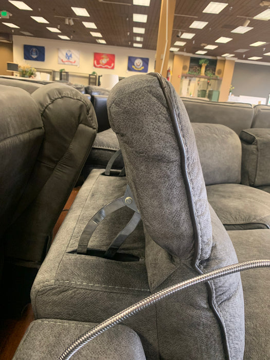The Power Reclining Sectional comes in gray and features multiple reclining angle options including the ability to lay flat or power up to the upright position. 
