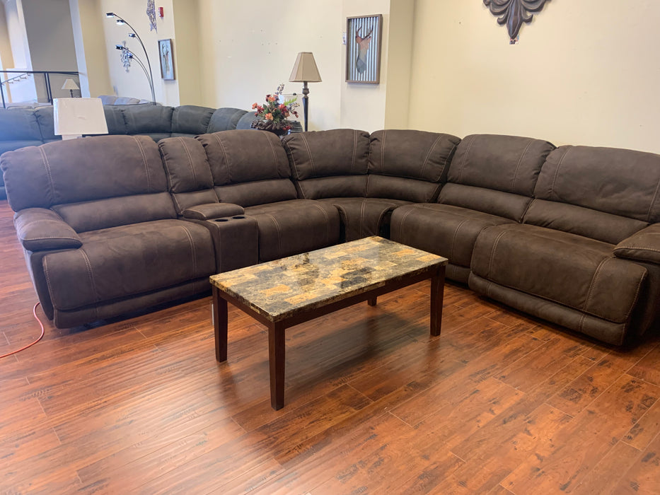 Get ready to sit back and relax with the Chester Brown sectional. This piece is made of a plush polyester fabric, and has a power reclining motion to put you into the perfect position for a movie or TV show.