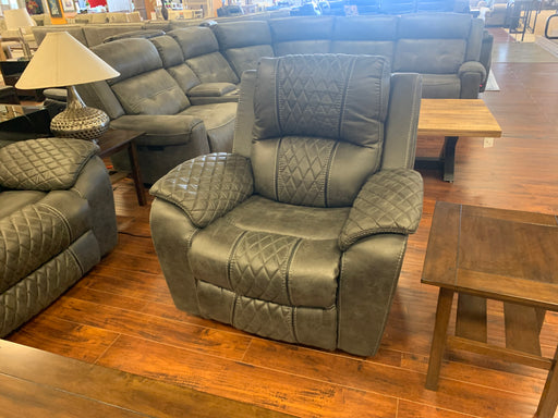 A work of art crafted from modern design and black faux leather upholstery, this living room favorite offers a manual reclining mechanism and sturdy construction to last for years - Lifestyle Furniture