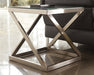 The modern geometric design of the metal bases is accented by the cross-bar detail on each piece, just underneath the table top.
