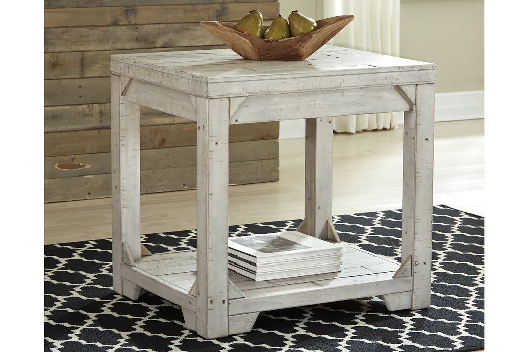 End tables are finished in a lightly distressed white with neutral wood grain highlights. A staple piece for any living space.