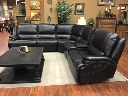 Key features include top-grain leather and hand tufting to create a comfortable and luxurious feel, plus an adjustable headrest for maximum comfort. 
